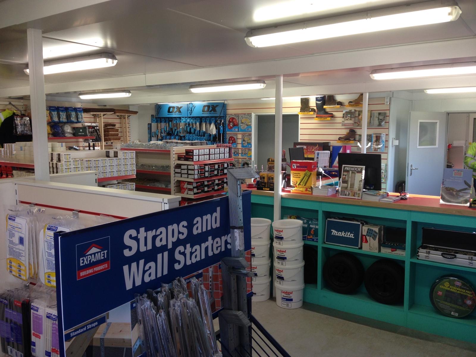 Fitted-out interior of a modular builders' merchant trade counter with shelving and displays